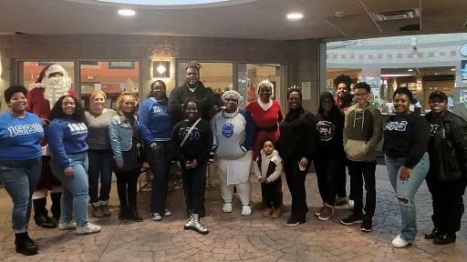 Image of Mark Talley, CEO and a small group of volunteers