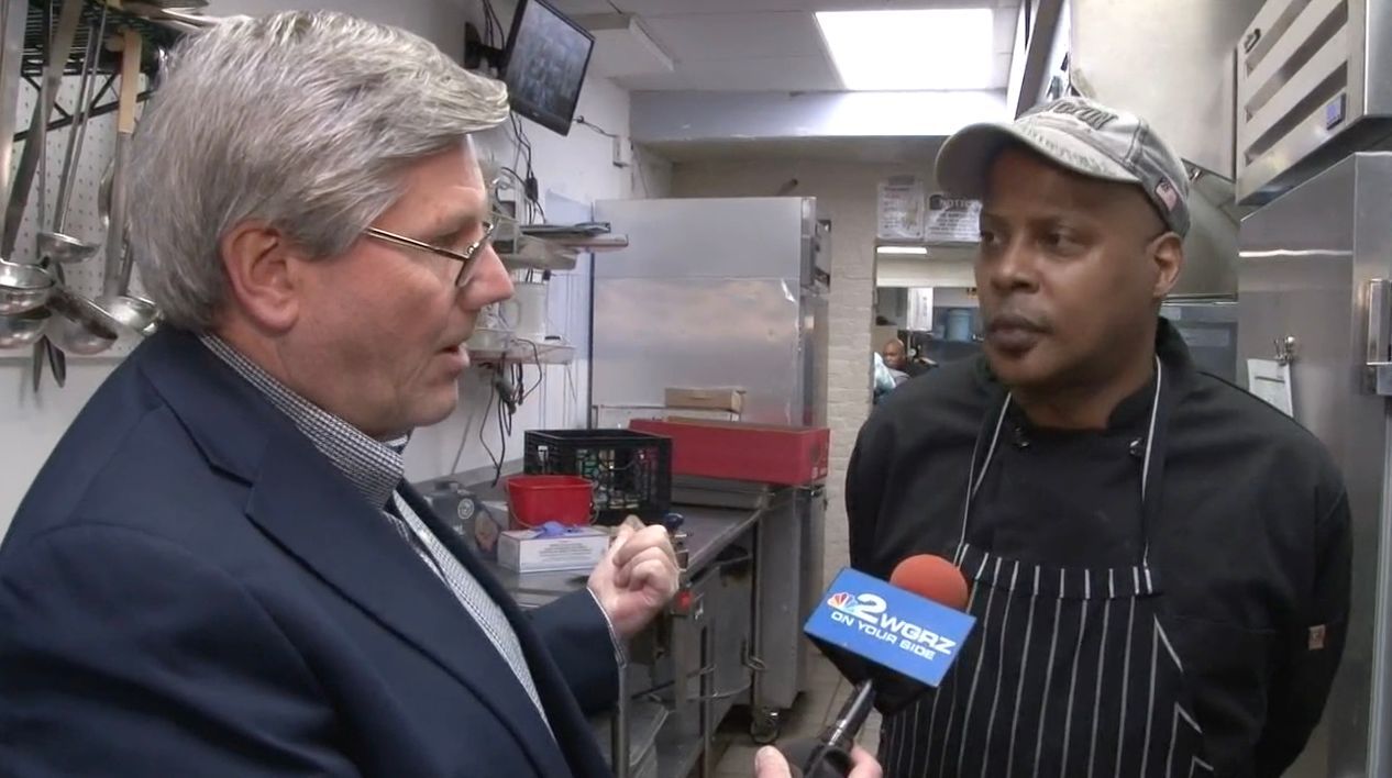 Volunteer speaking with WGRZ about Thanksgiving Meal Event